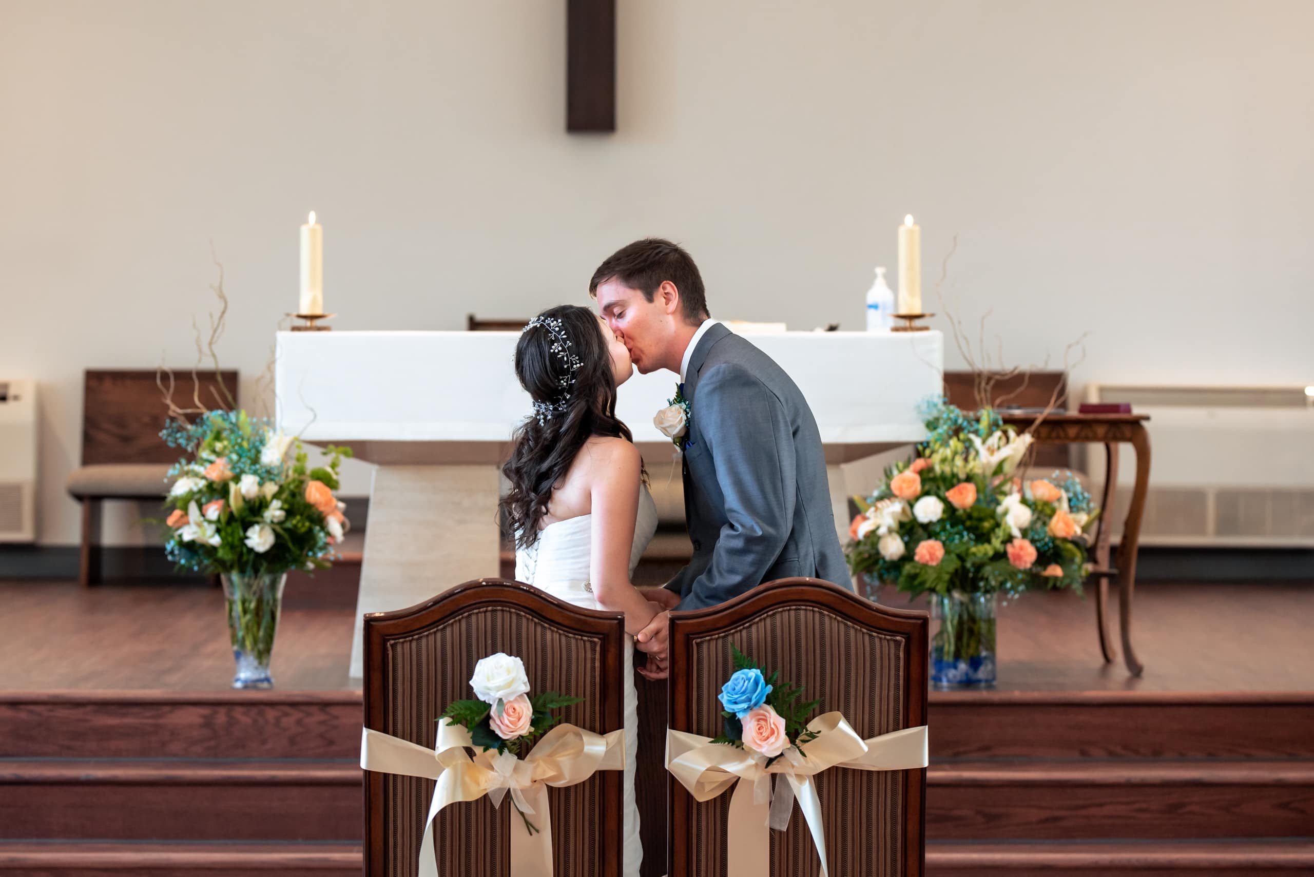 first kiss our lady of grace church wedding ceremony by Durham Region Wedding Photographer Brian Ly Photography